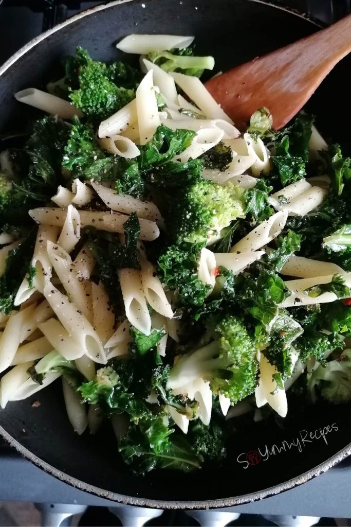 Pasta kale salad on frying pan.