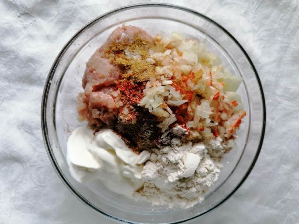 a bowl of chicken kebab ingredients