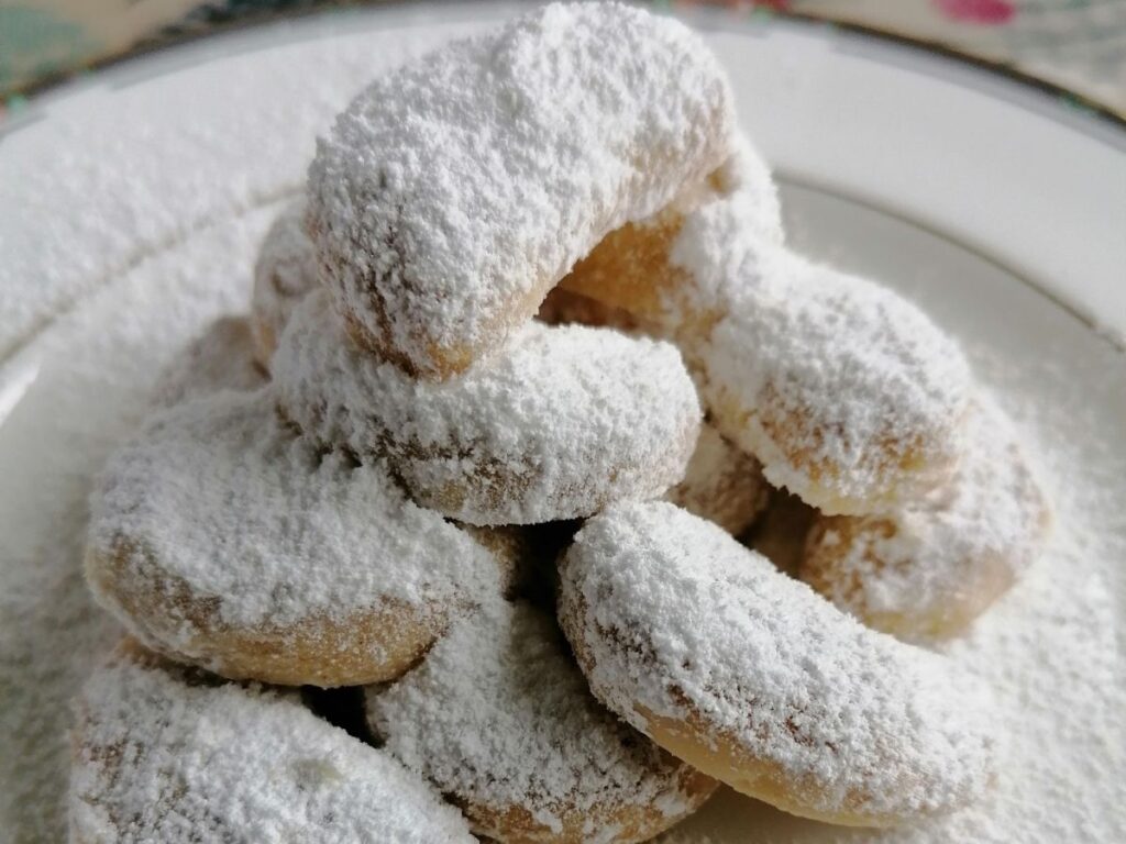 ready baked kue putri salju coated with icing sugar