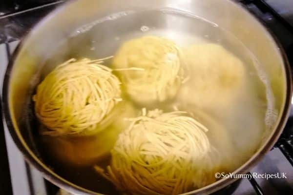 boiling noodles in a pot