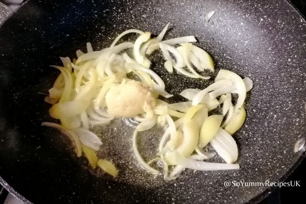 frying onion slices and garlic paste