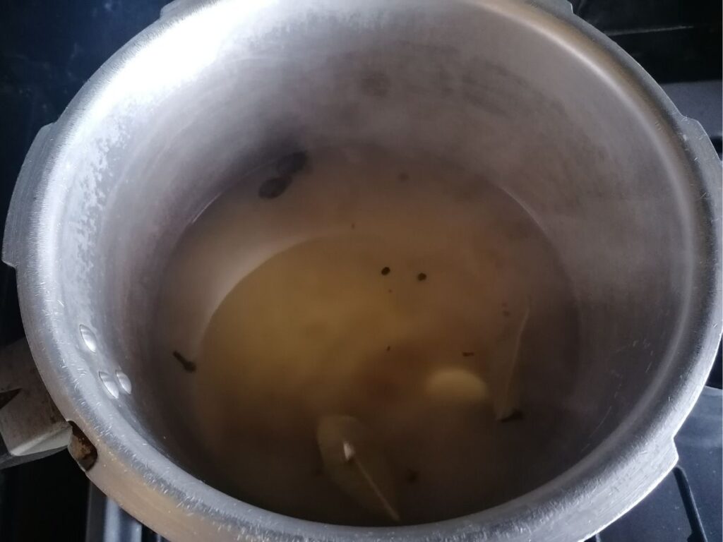adding water to the kitchari rice
