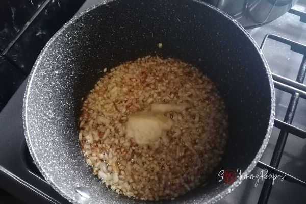 onion and ginger garlic paste frying in a pan