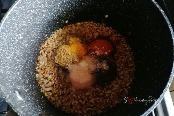 spices and fried onions in a pan