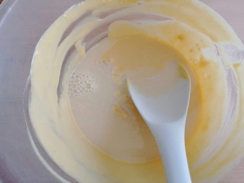 mixing the dry ingredients with water for making dokhra