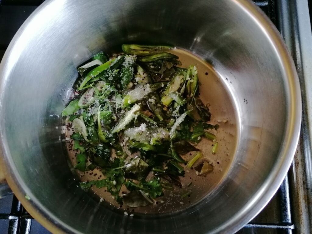 frying herbs and spices for tarka