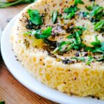 khaman dhokla garnished with green chillies