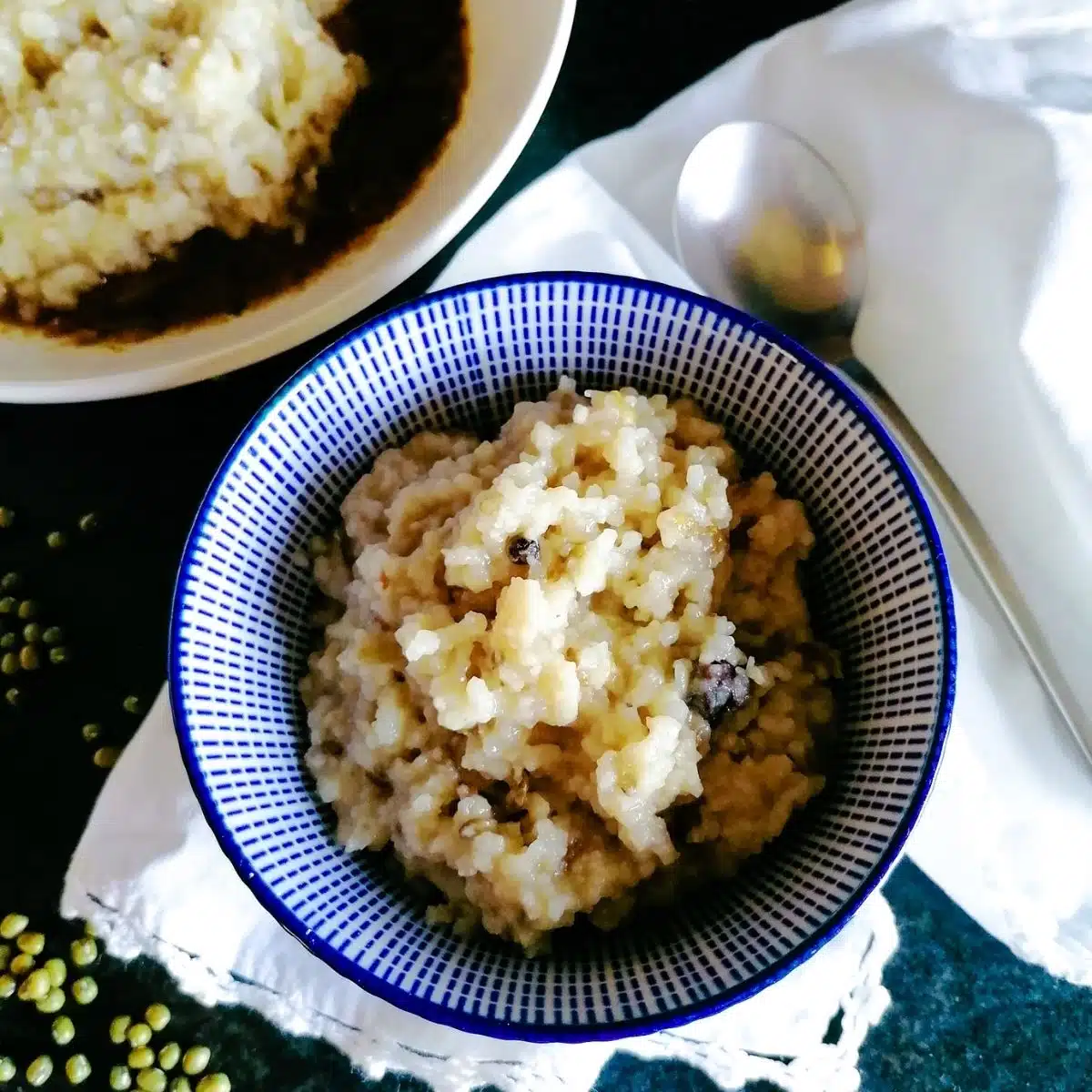 Kitchari mung beans in a blue patterned bowl