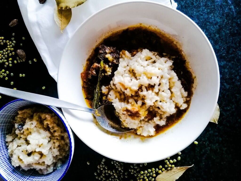 a bowl of kitchari mung beans with sauce and a bowl of plain kitchari mung beans
