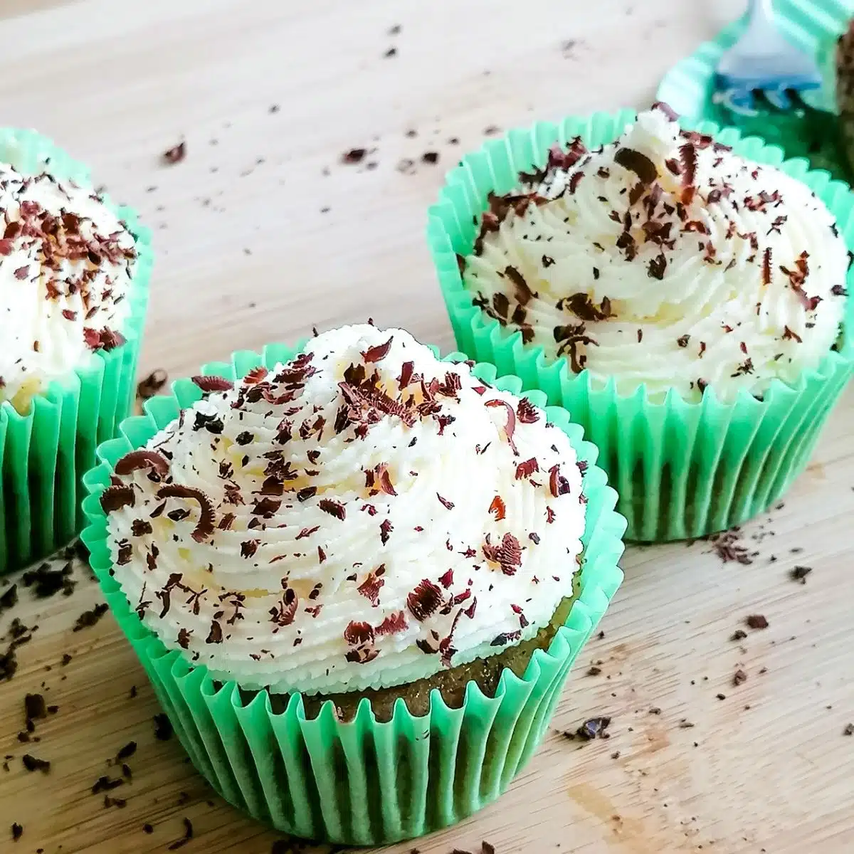 a few apple cupcakes with cream cheese frosting.
