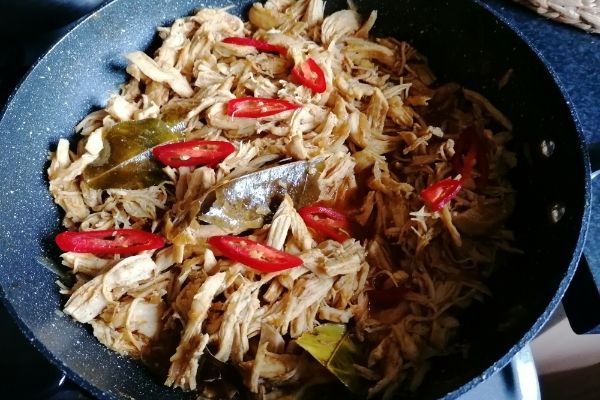Balinese spicy shredded chicken in a pan