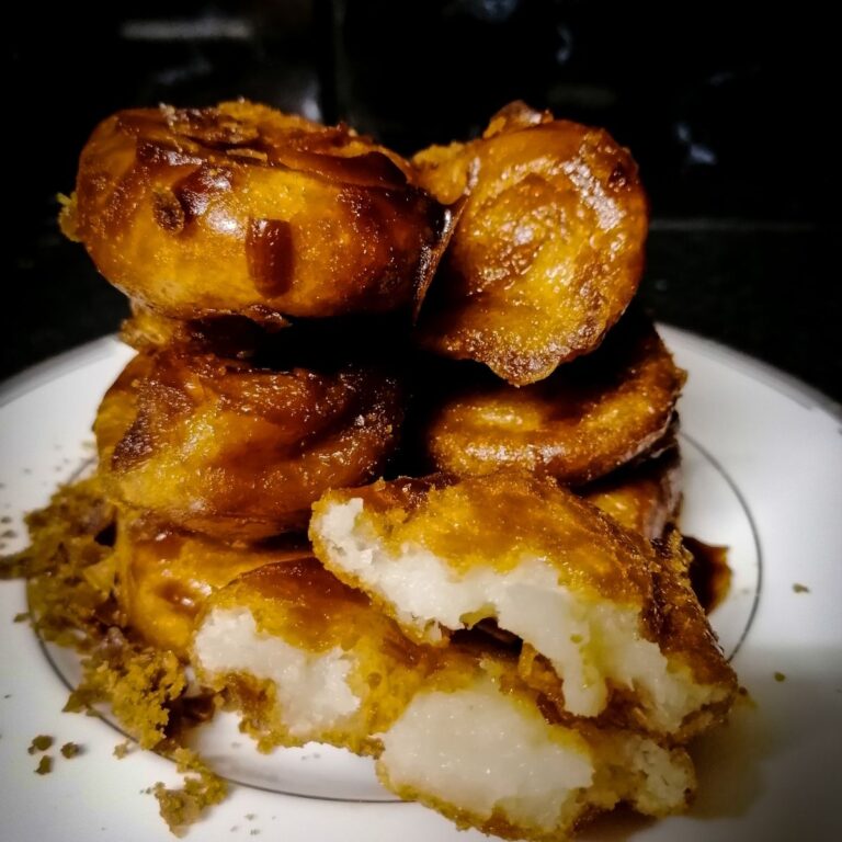A stack of Gemblong - the Indonesian sweet treat made of glutinous rice and coconut with brown sugar coating