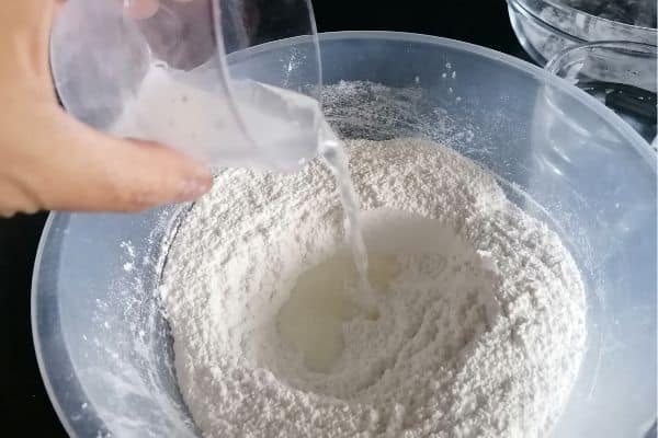 adding water to glutinous rice flour