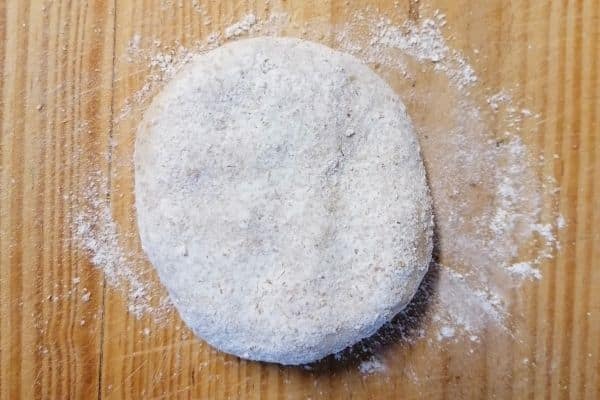Flattened roti dough