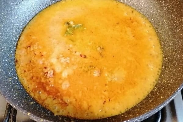 Add the water to the spice