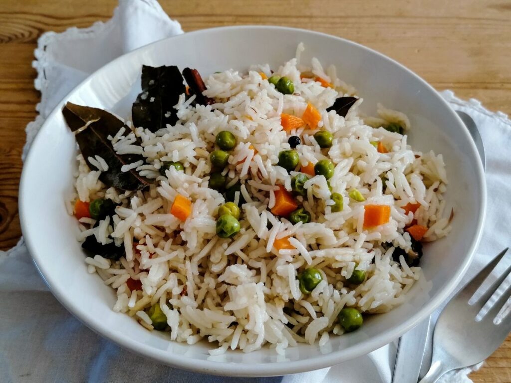 Vegetable pilau rice in a white bowl