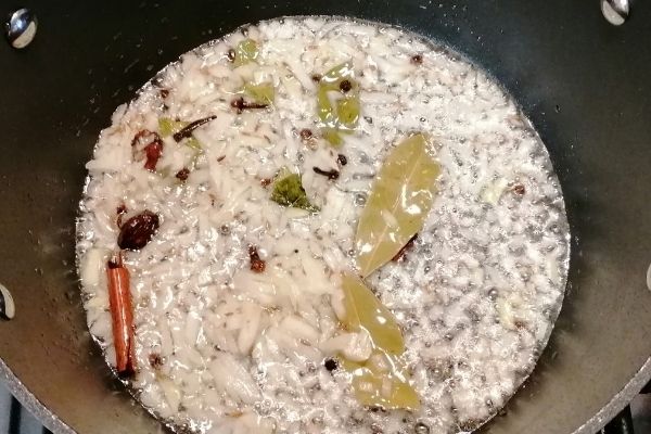 frying onions and spices for pilau rice