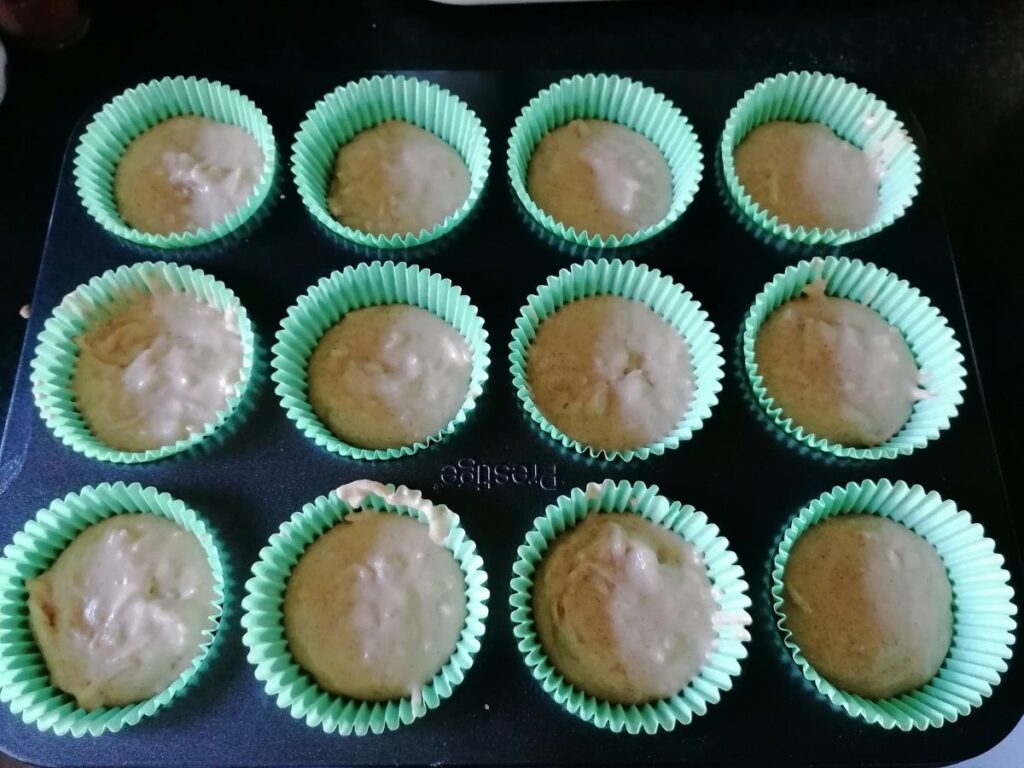 filled cupcake cases ready to bake