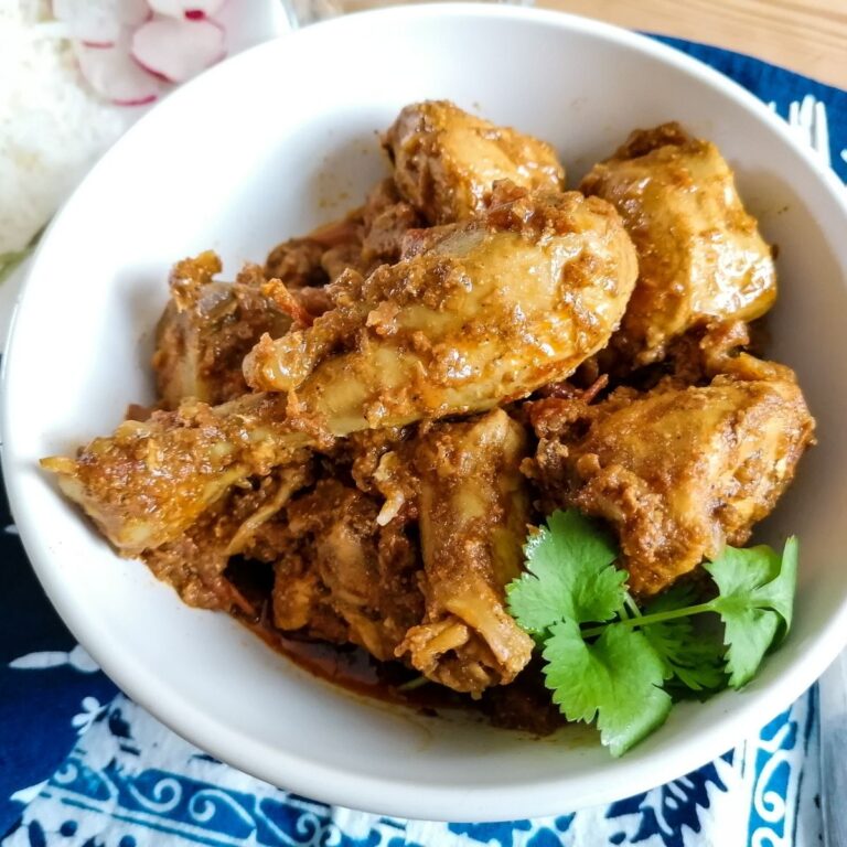 Chicken Karahi Pakistani style in a white bowl with coriander leaves garnish