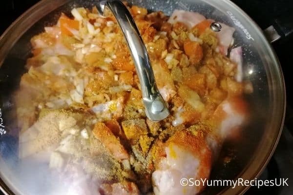 cooking chicken pieces with a lid on