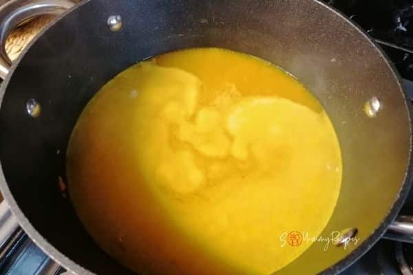 boiling water with turmeric and spices