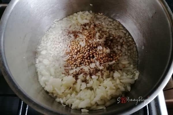 chopped onion and whole spices