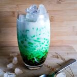 Cendol in a tall glass with ice cubes