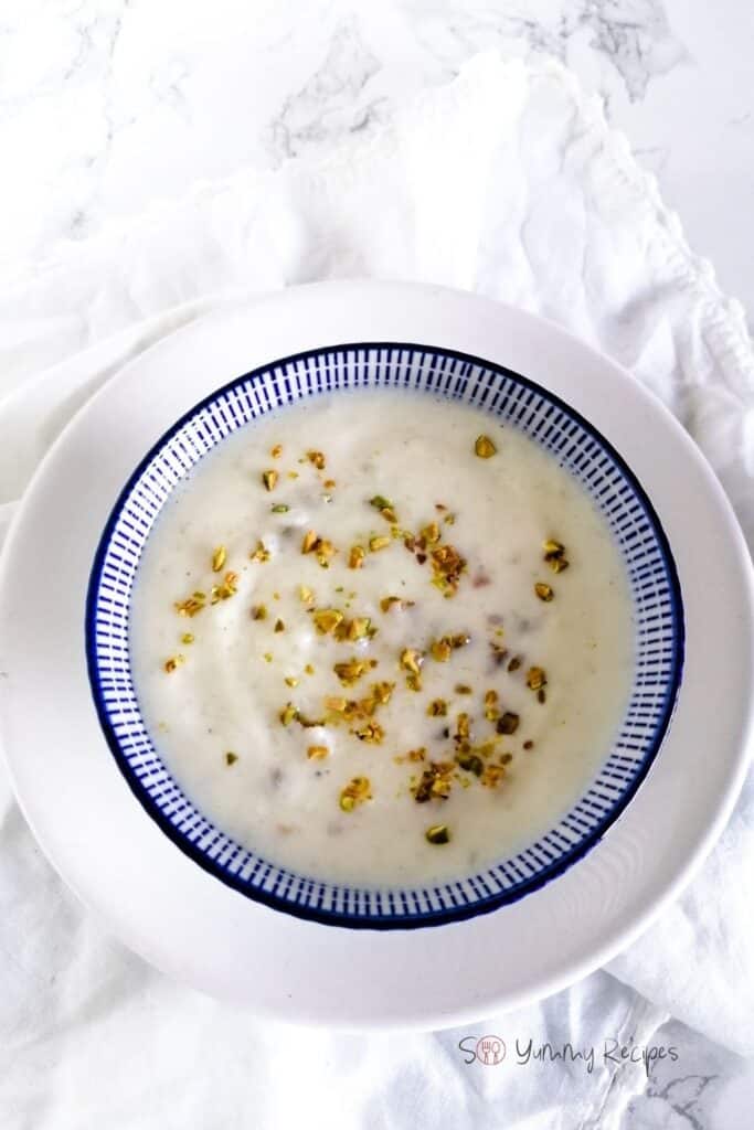 Kheer - Pakistani rice pudding - in a blue bowl