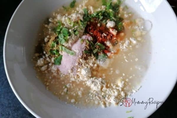 gram flour with spices and chopped coriander leaves