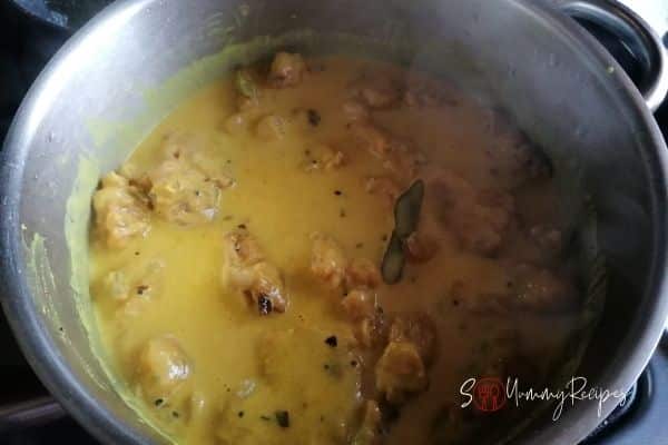 pakoras cooking in yoghurt base sauce