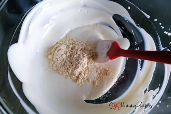 yoghurt and gram flour in a bowl