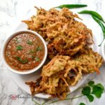 vegetable pakoras and a bowl of chilli tomato chutney