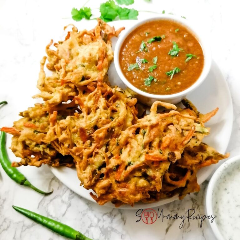 vegetable pakora with a bowl of tomato chilli chutney