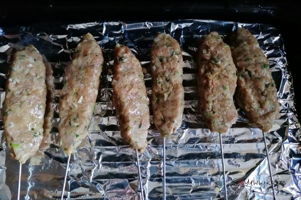 chicken seekh kebabs in the grill