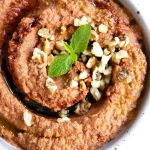 a bowl of Muhammara - Red Pepper And Walnut Dip.