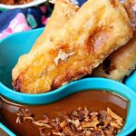 fried bananas with peanut sauce on the side.