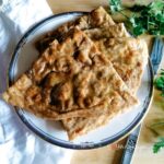 quarter pieces of aloo paratha - Pakistani fried flatbread with potato filling