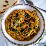 a dish of Dahi Baingan - Pakistani aubergine in spicy yoghurt sauce