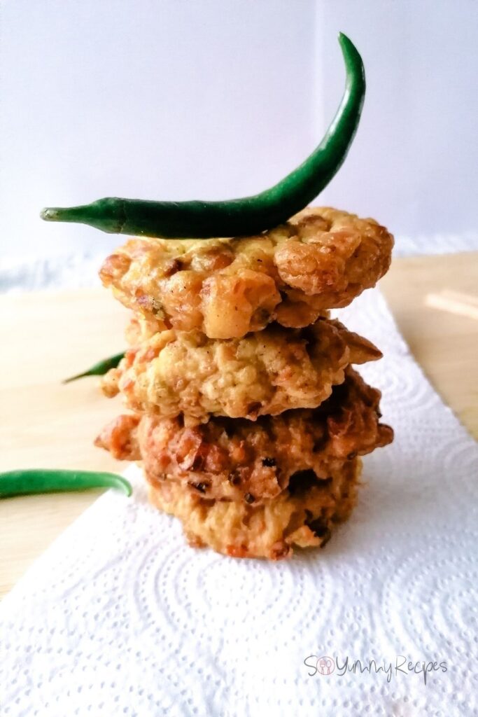 A pile of Perkedel Tempe with a green chilli on top