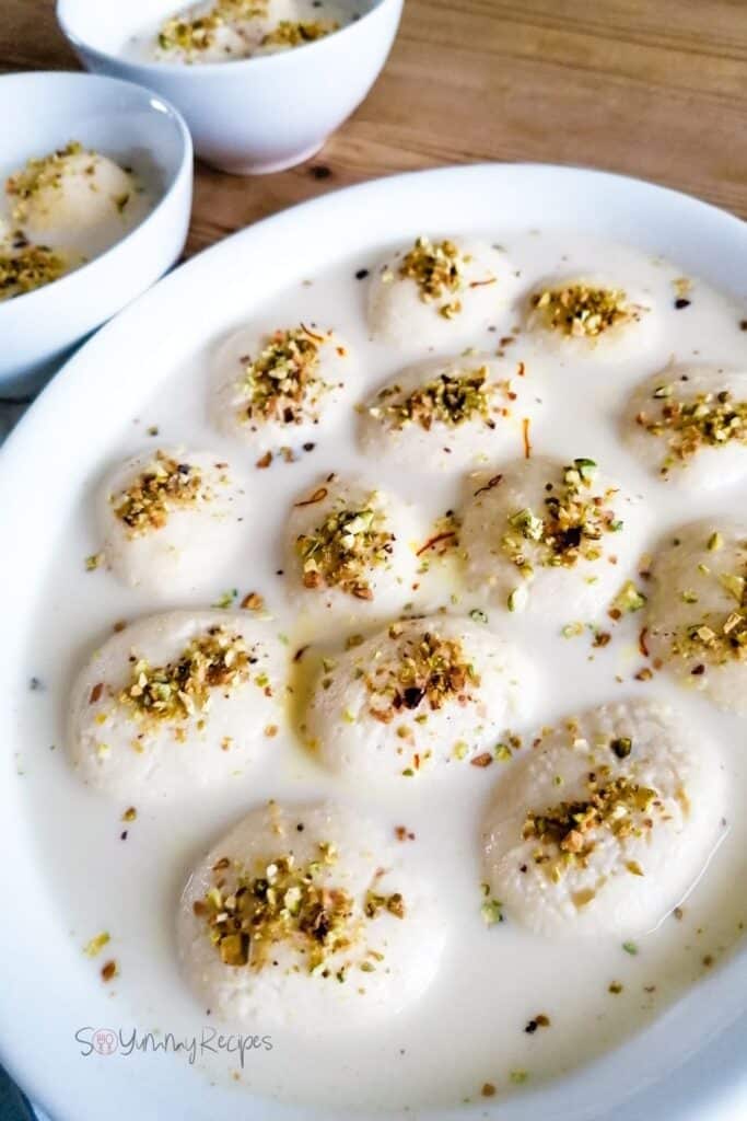 a large dish and two small bowls of milk dumplings in fragranced and sweetened milk