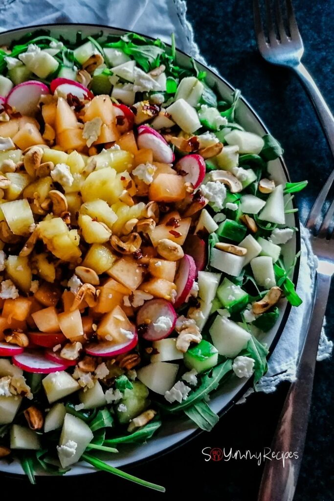 a plate of Apple, Melon And Pineapple Salad With Balsamic Vinegar