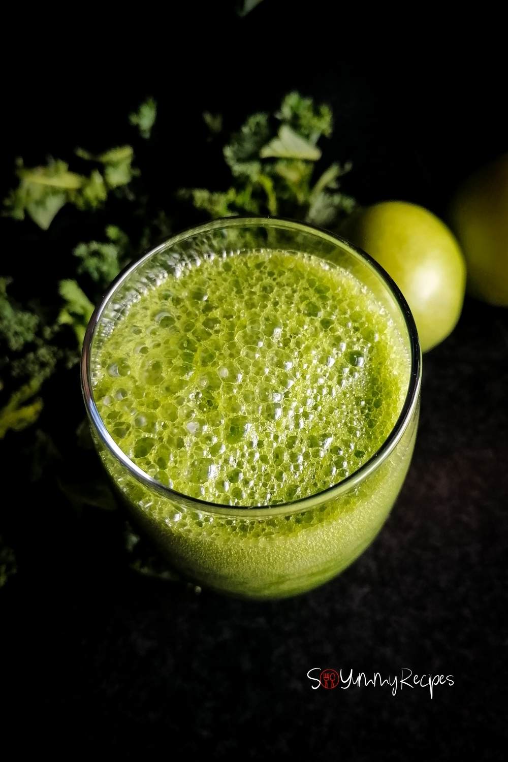 over the top of a glass of green smoothie