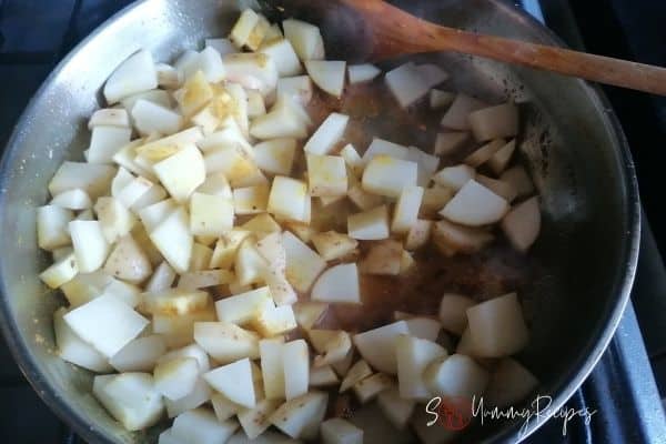 cooking the potatoes with spices