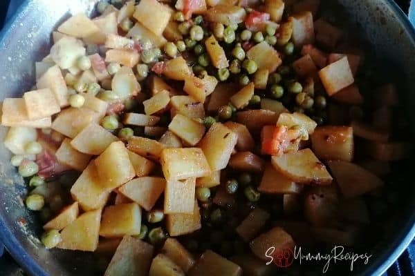 Aloo Matar is readily cooked in a pan