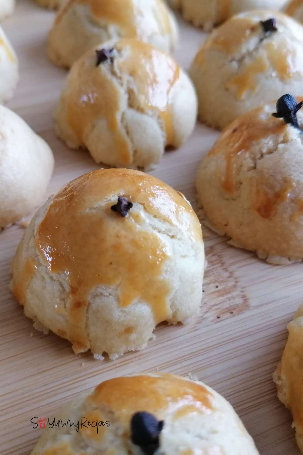 Nastar cookies on a wooden chopping board.