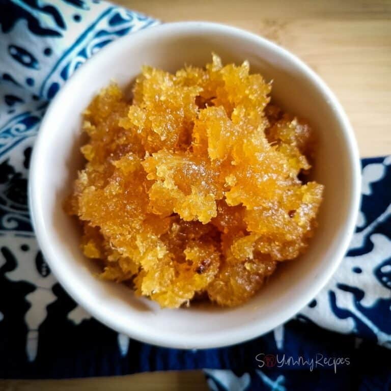 a white bowl of Indonesian pineapple jam with blue patterned napkin underneath.