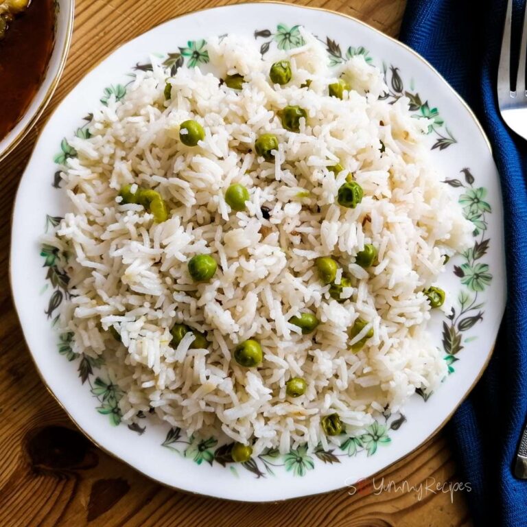 Matar Chawal the Pakistani rice dish with green peas on a round dish.