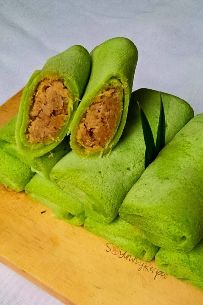 A stack of Dadar Gulung - the Indonesian pandan pancake with coconut and palm sugar filling.