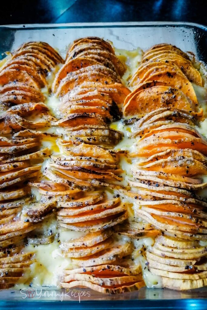 Microwave sweet potato gratin in a rectangle dish.