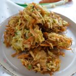 Bakwan Sayur the Indonesian vegetable fritters on a round plate.